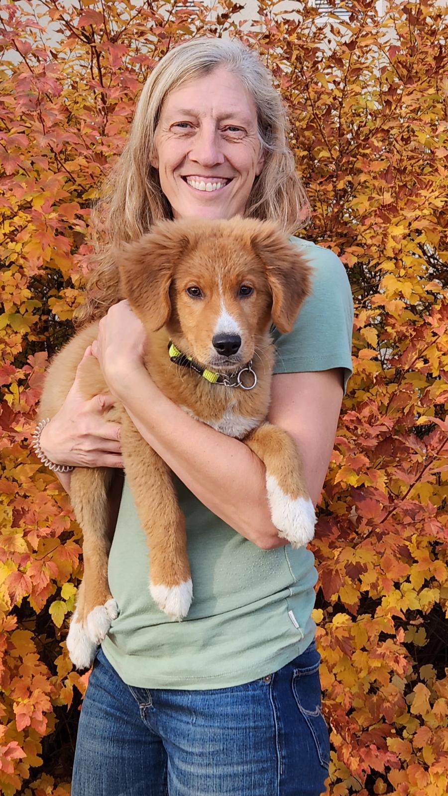 Connie holding Zeke, the resident dog